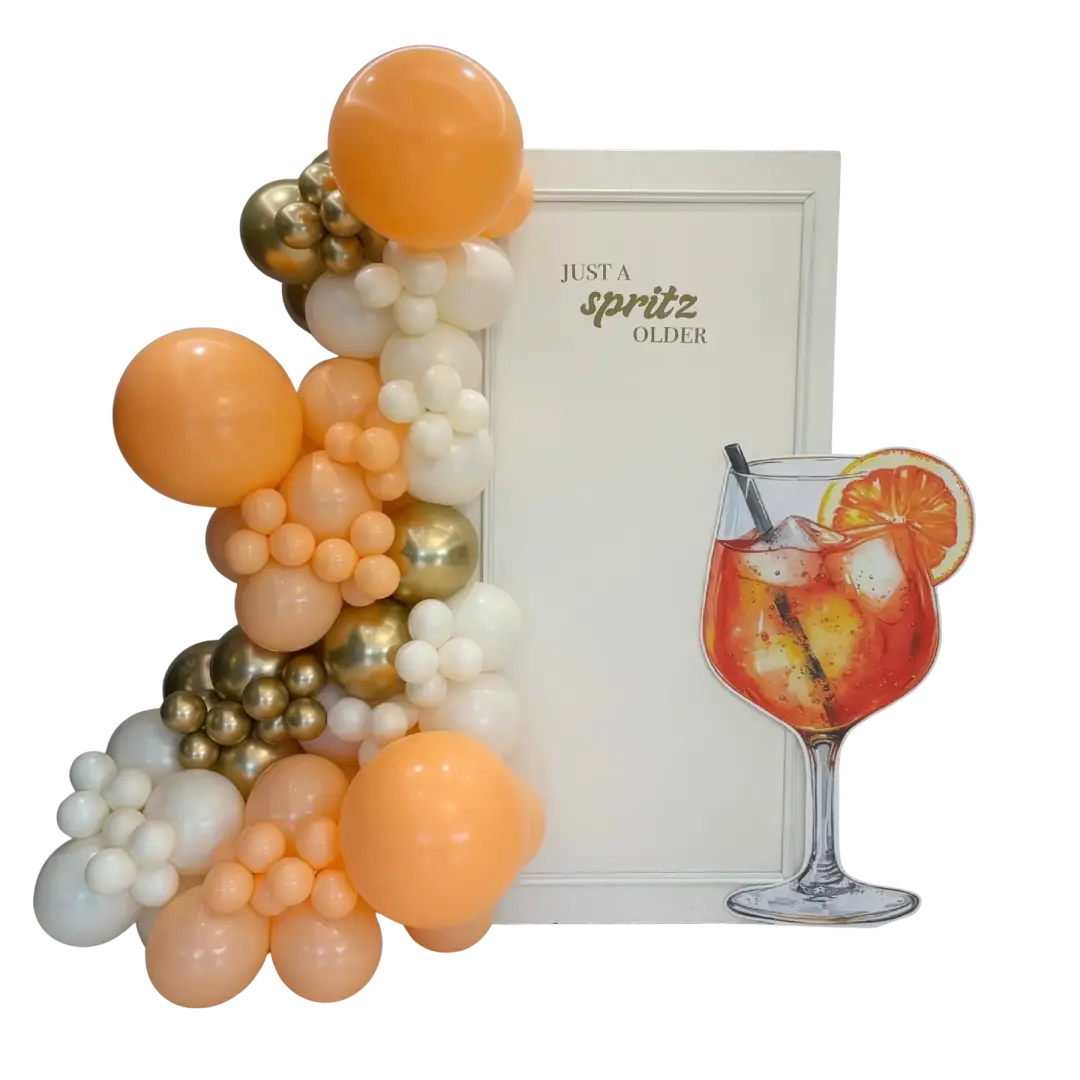 Orange, cream and gold themed balloon display with a spritz illustration