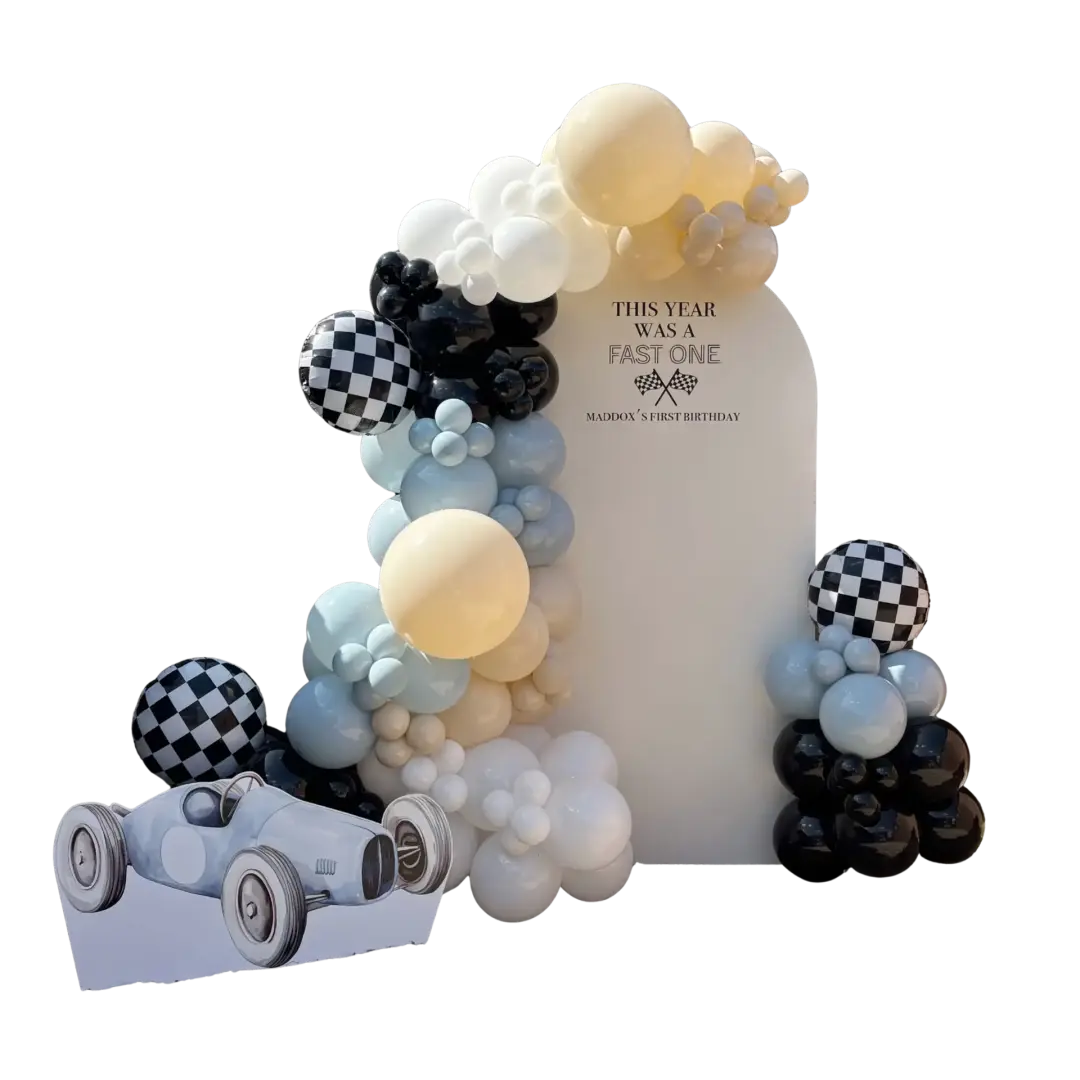 Black, white, cream and blue racing-themed first birthday balloon display