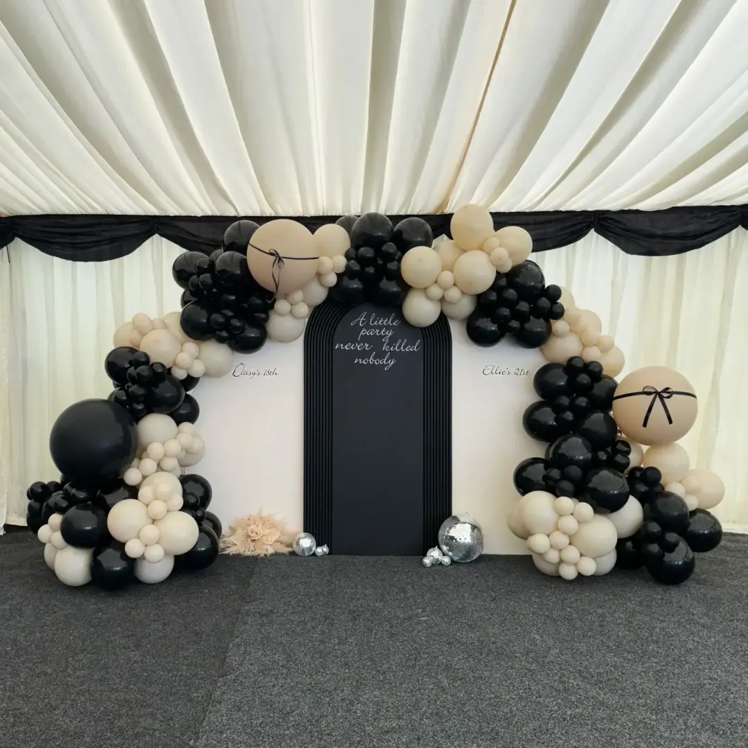 Black, cream and white balloon feature wall