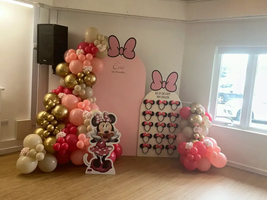 Pink, red and gold Minnie Mouse balloon display