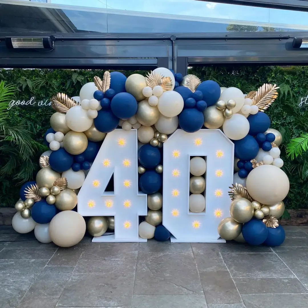 Navy, white and gold fortieth birthday balloon arch