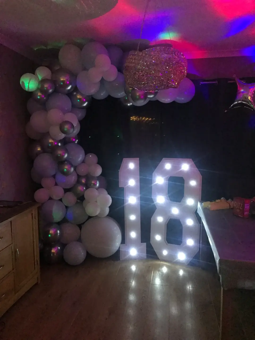 White and silver eighteenth birthday balloon arch